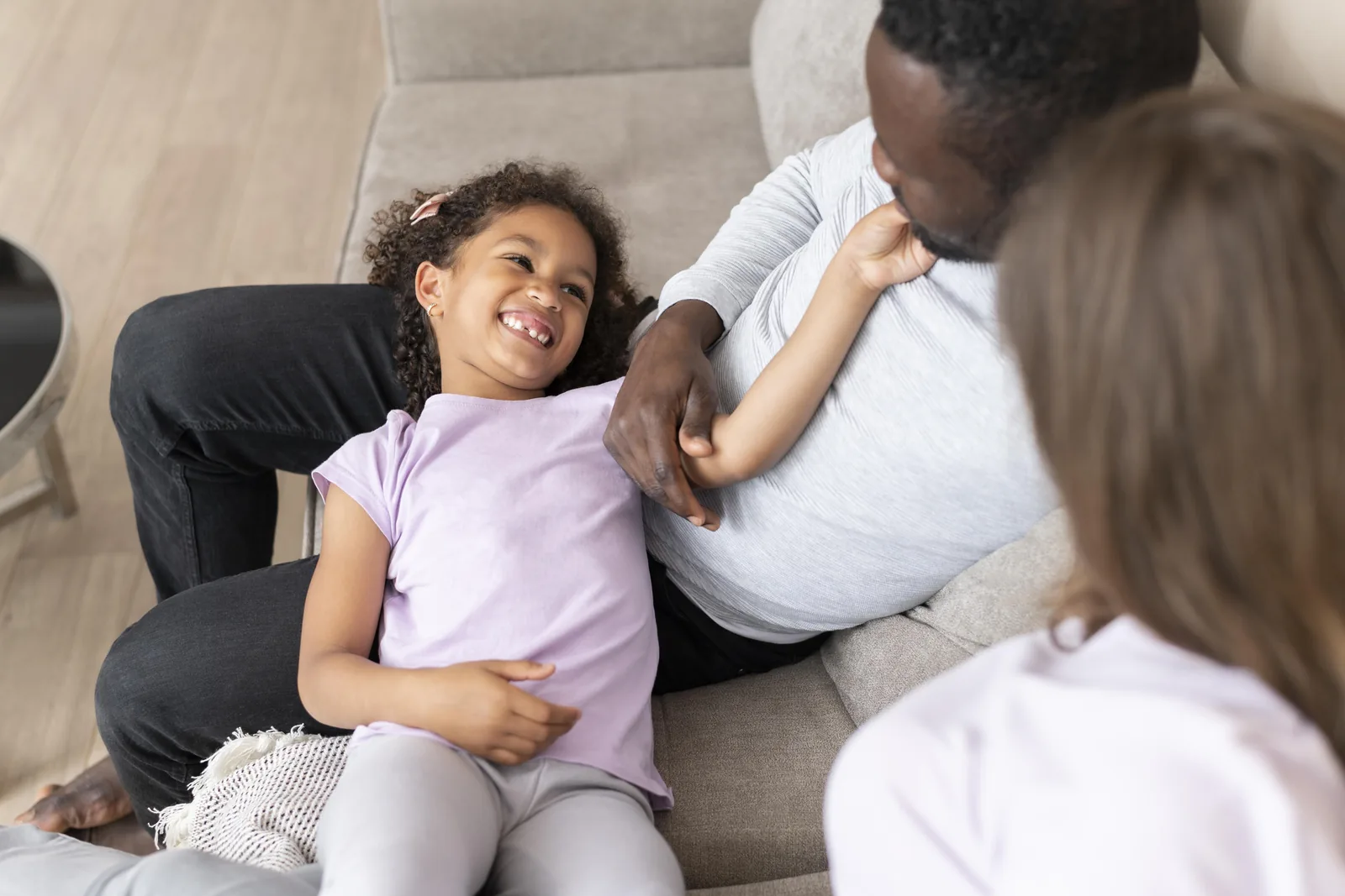 Parents and their child spending time together at home